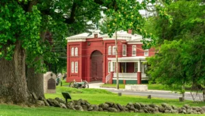 Historic red brick building with Civil War cannon in Abingdon VA — one of the best things to do in Abingdon VA